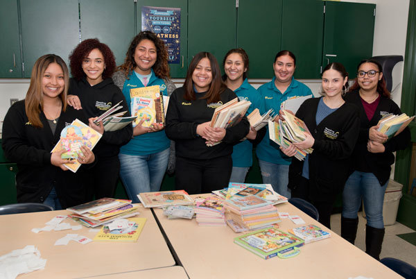 A group of students who lent a hand to a program that promotes family reading