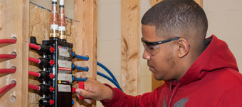 RMCTC student works in the Plumbing classroom