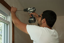 student using cordless drill-driver