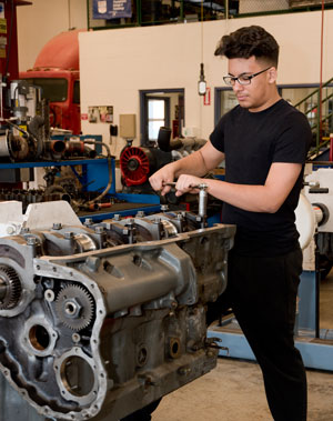 RMCTC student works on a diesel engine.