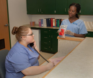 Health-Medical Office students simulate an office interaction during class.