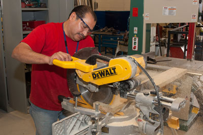 Adult student using chop saw