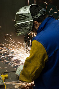 adult student grinding steel