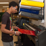 student working in the printing lab