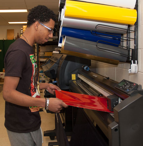 student working in the printing lab
