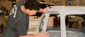Student sanding a car in Auto Body Repair
