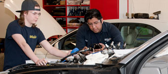 Auto Tech students work on a car.