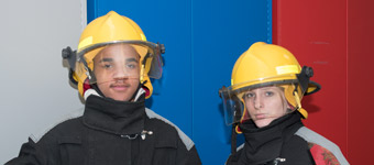 Two Public Safety & Security students in firefighting gear
