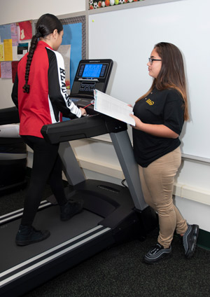 Sports Medicine students simulate an exercise routine.