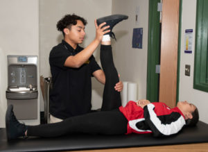 Sports Medicine students practice stretching techniques.