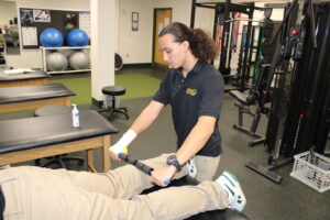 HSM student working on a patient