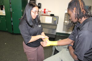 HSM student wrapping a wrist